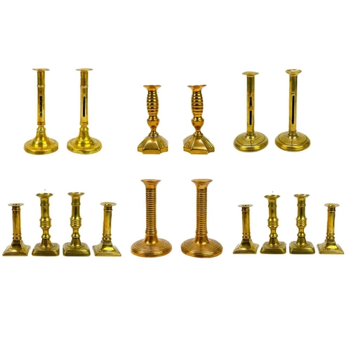 166 - A pair of 18th century brass ejector candlesticks. Height 21cm together with five pairs of brass can... 