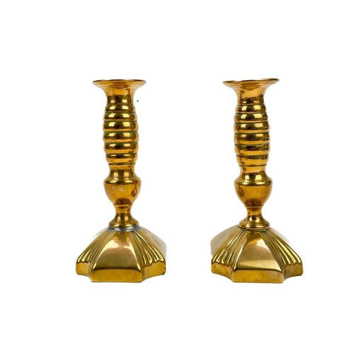 166 - A pair of 18th century brass ejector candlesticks. Height 21cm together with five pairs of brass can... 