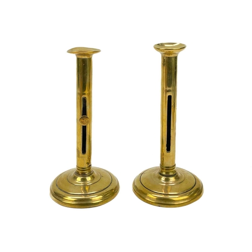 166 - A pair of 18th century brass ejector candlesticks. Height 21cm together with five pairs of brass can... 