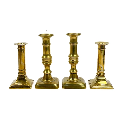 166 - A pair of 18th century brass ejector candlesticks. Height 21cm together with five pairs of brass can... 