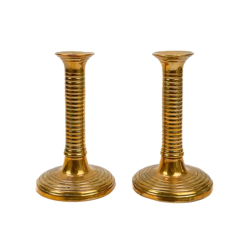 166 - A pair of 18th century brass ejector candlesticks. Height 21cm together with five pairs of brass can... 