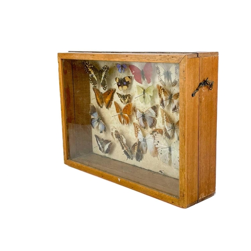 167 - A Victorian velvet framed bevelled edge wall mirror with integral shelf and pair of candle sconces. ... 