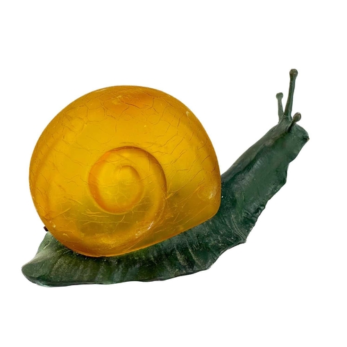 169 - A novelty table lamp in the form of a snail. The simulated bronze body surmounted by an amber glass ... 