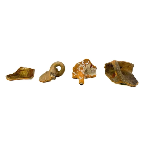 173 - A collection of post Medieval and later pottery shards. Some with incised decoration, one piece appe... 