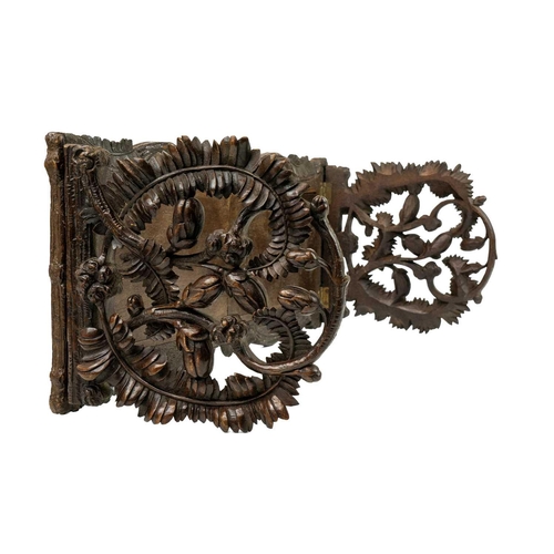 174 - A late 19th century Black Forest book slide. The pierced carved ends decorated with fern leaves and ... 