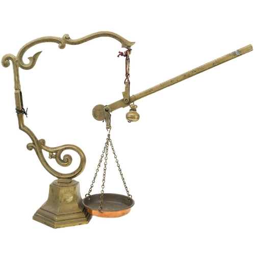 176 - An early 20th century brass balance scales Marked MDVC, height 50cm.