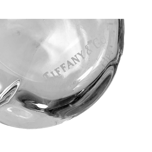 22 - A collection of decorative glassware to include a Tiffany & Co paperweight. In the form of a sleepin... 