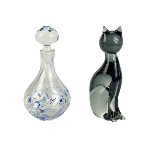 22 - A collection of decorative glassware to include a Tiffany & Co paperweight. In the form of a sleepin... 