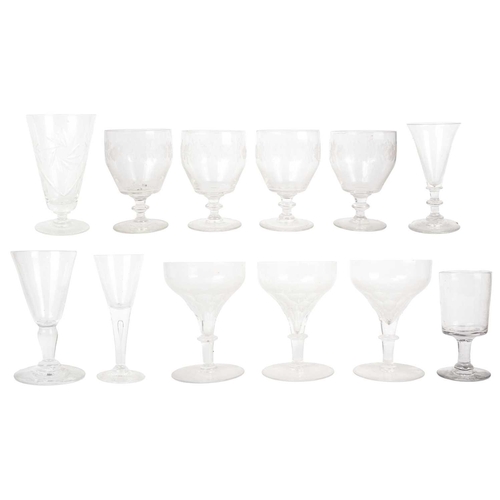 359 - A set of four 19th century English glass rummers. Engraved with flowers, height 12cm together with o... 