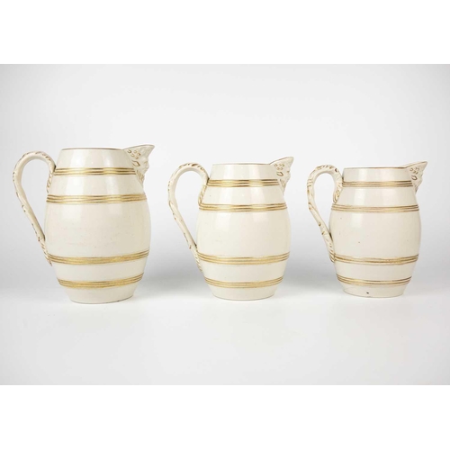 360 - A set of six 19th century English porcelain barrel mask jugs. Tallest 19.5cm together with a twin ha... 