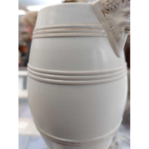 360 - A set of six 19th century English porcelain barrel mask jugs. Tallest 19.5cm together with a twin ha... 