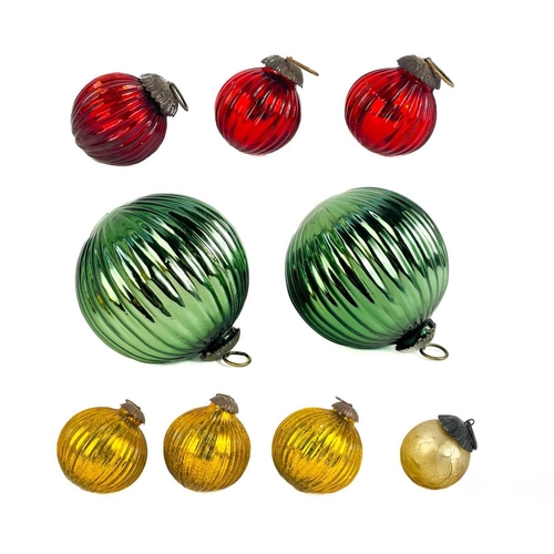 371 - A collection of nine glass hanging balls. In various sizes and colours. The largest measures 12cm in... 