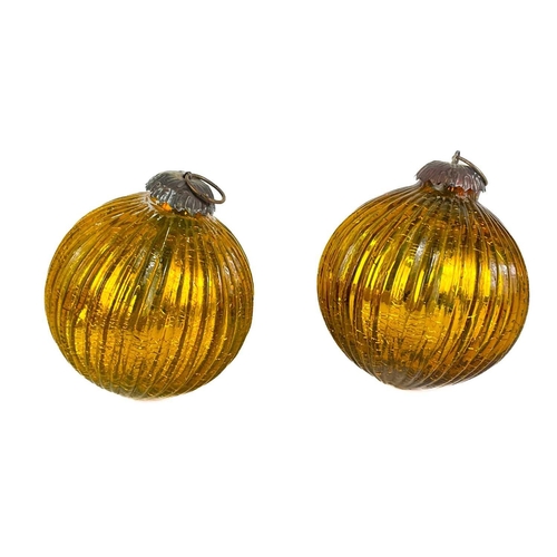 372 - A collection of glass nine hanging balls. In various sizes and colours. The largest measures 12cm in... 