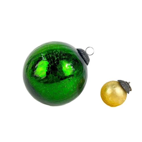 372 - A collection of glass nine hanging balls. In various sizes and colours. The largest measures 12cm in... 