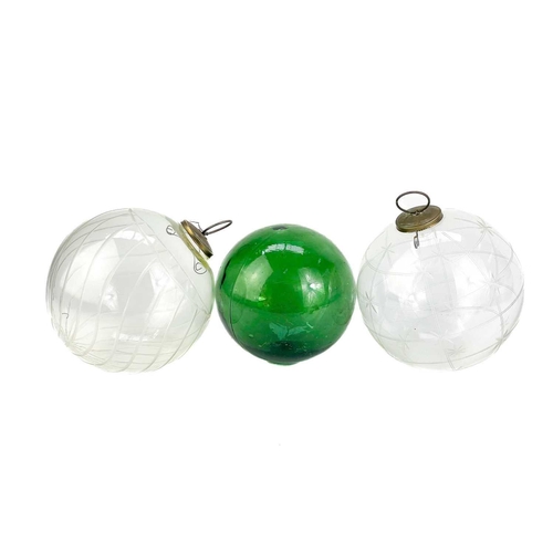373 - A collection of glass hanging balls. In various sizes and colours. The largest measures 14cm in diam... 