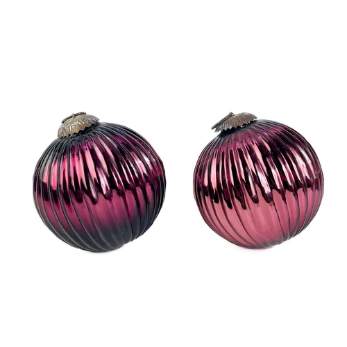 374 - A collection of glass hanging balls, In various sizes and colours. The largest measures 12cm in diam... 