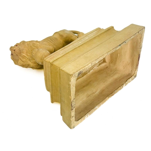 377 - A pair of early 20th century terracotta Medici lions. Raised on plinth bases indistinctly signed and... 