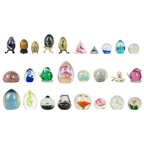 384 - A collection of glass paper weights. Together with other glass items.