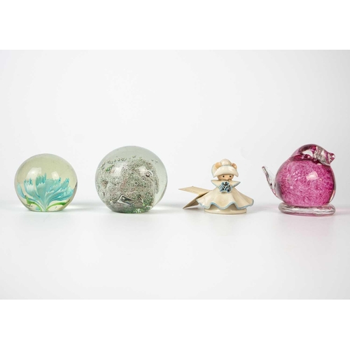 384 - A collection of glass paper weights. Together with other glass items.