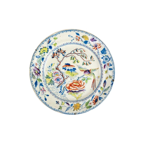 386 - A 19th century armorial plate. The centre painted with a dragon passant, within borders decorated wi... 