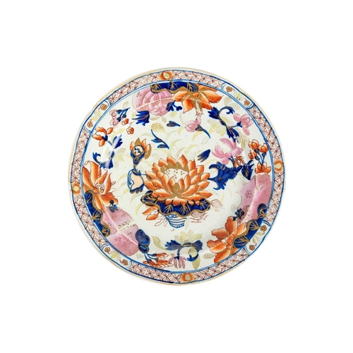 386 - A 19th century armorial plate. The centre painted with a dragon passant, within borders decorated wi... 