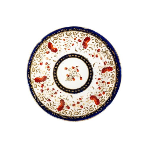 386 - A 19th century armorial plate. The centre painted with a dragon passant, within borders decorated wi... 