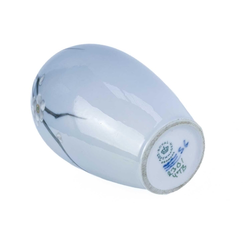 389 - A Royal Copenhagen vase. With flower and dragonfly painted decoration, height 14cm; together with a ... 