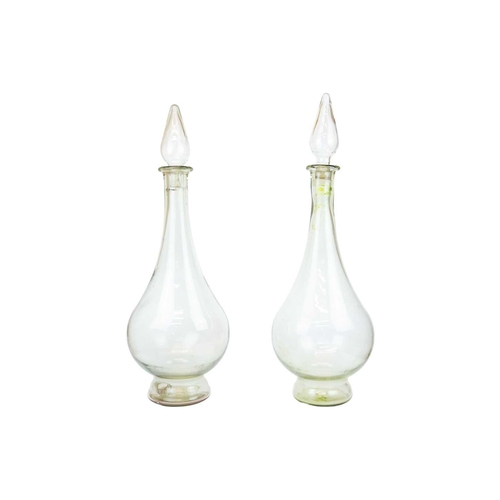 398 - A pair of large modern apothecary display glass decanters and stoppers. Height 80cm.