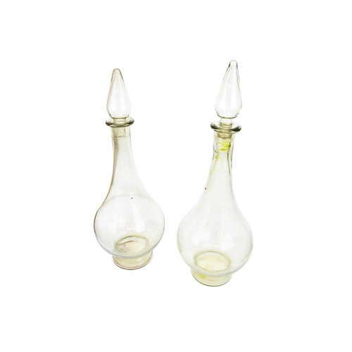 398 - A pair of large modern apothecary display glass decanters and stoppers. Height 80cm.