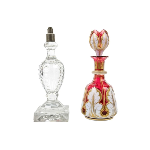 403 - A Bohemian cranberry flash white overlay glass decanter and stopper. Height 23.5cm, together with a ... 