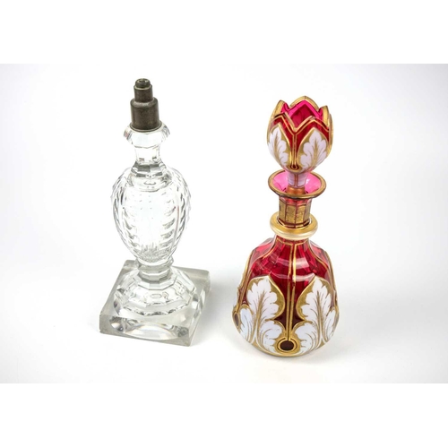 403 - A Bohemian cranberry flash white overlay glass decanter and stopper. Height 23.5cm, together with a ... 