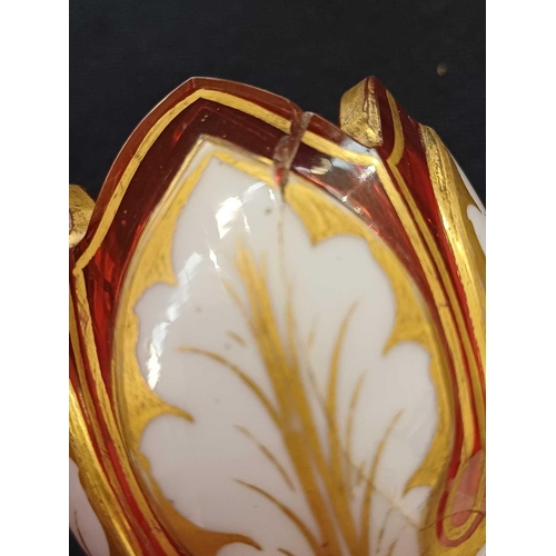 403 - A Bohemian cranberry flash white overlay glass decanter and stopper. Height 23.5cm, together with a ... 