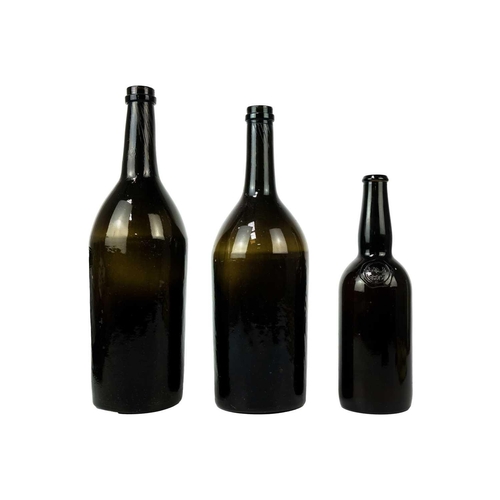 411 - A green glass magnum wine bottle, circa 1820. With kick-up base, height 35cm, another similar magnum... 