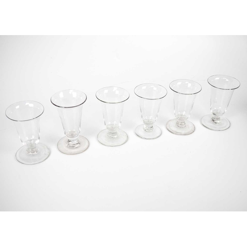 417 - A set of six similar 19th century syllabub glasses. Tallest 10cm, together with a pair of glass cand... 