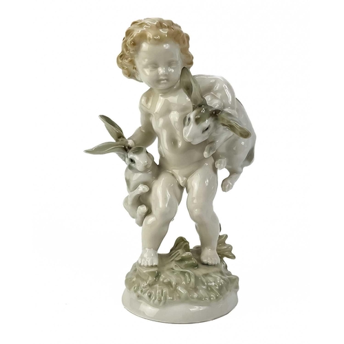 480 - Karl Tutter for Hutschenreuther porcelain figure. Modelled as a young boy with two rabbits. impresse... 