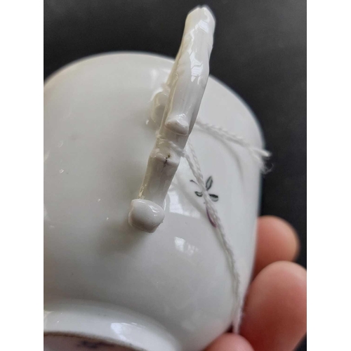 481 - A Meissen porcelain cup. Circa 1780, with a wishbone handle and floral painted decoration, crossed s... 