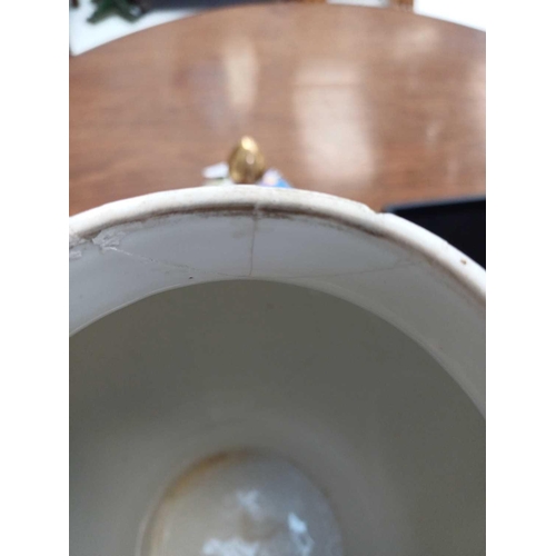 483 - A pair of German porcelain baluster vases and covers. Decorated on blue ground with panels of courti... 