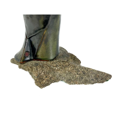 486 - Humfrey Wakefield - A pottery cormorant on stone stand. With HW seal mark. Height 39cm. Together wit... 