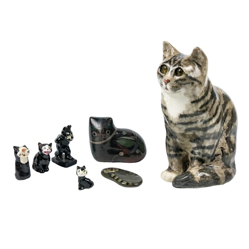 488 - A Winstanley pottery tabby cat. Height 28cm. Together with a Brunido pottery cat and five other smal... 