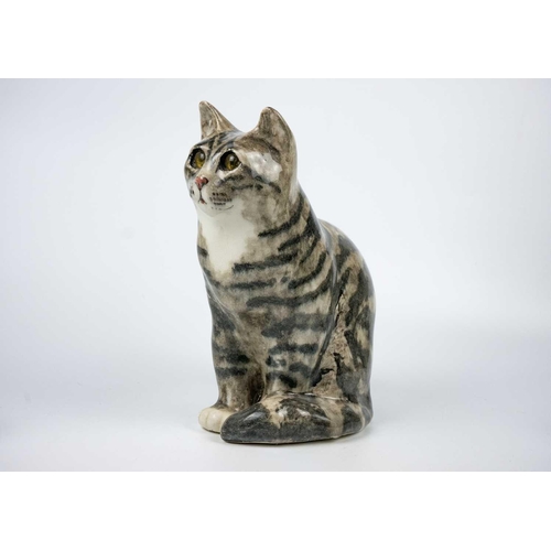 488 - A Winstanley pottery tabby cat. Height 28cm. Together with a Brunido pottery cat and five other smal... 