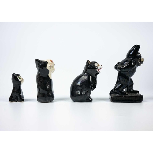 488 - A Winstanley pottery tabby cat. Height 28cm. Together with a Brunido pottery cat and five other smal... 