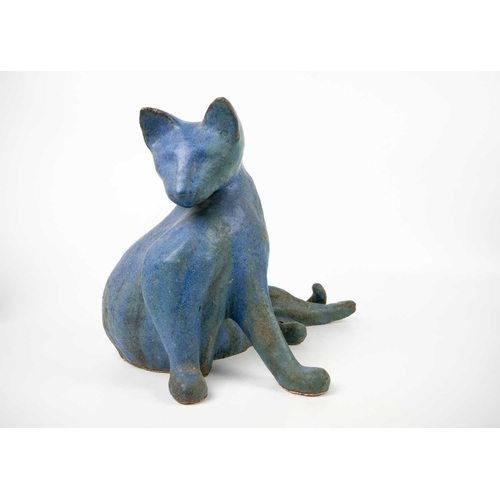 489 - A glazed blue ceramic cat figurine. Height 29cm. Together with seven other various feline figurines.