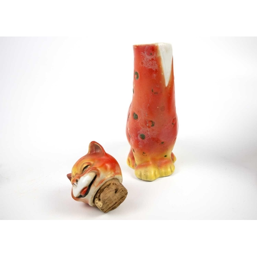 489 - A glazed blue ceramic cat figurine. Height 29cm. Together with seven other various feline figurines.