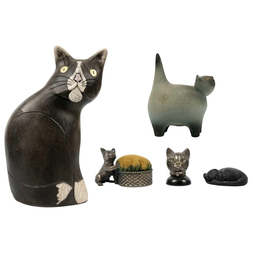 491 - A Tony White cat ceramic figurine. Height 27cm. Together with a pin cushion metal cat figurine and t... 