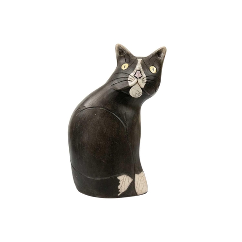 491 - A Tony White cat ceramic figurine. Height 27cm. Together with a pin cushion metal cat figurine and t... 