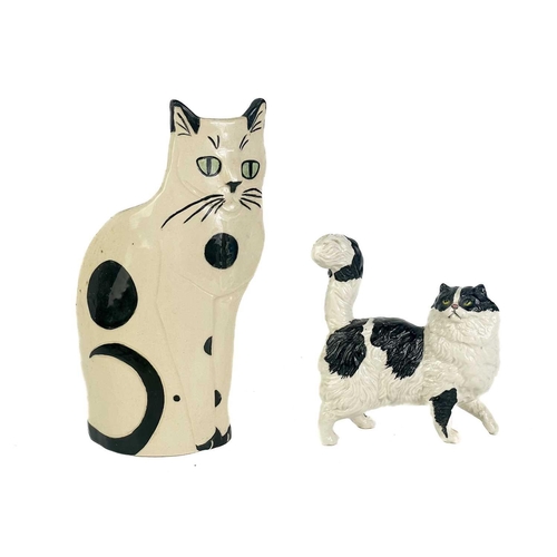 492 - A P Rada pottery floral cat figurine. Height 14cm. Together with four other ceramic and pottery cat ... 