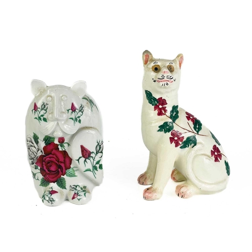 492 - A P Rada pottery floral cat figurine. Height 14cm. Together with four other ceramic and pottery cat ... 