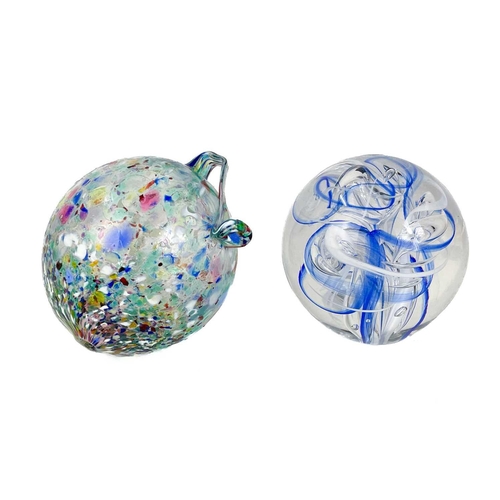 494 - A Langham England paperweight. In swirling blues and whites. Together with 2 other paperweights and ... 