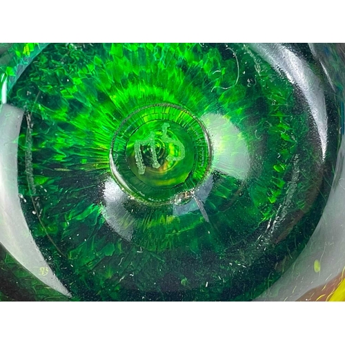 494 - A Langham England paperweight. In swirling blues and whites. Together with 2 other paperweights and ... 