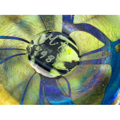 494 - A Langham England paperweight. In swirling blues and whites. Together with 2 other paperweights and ... 